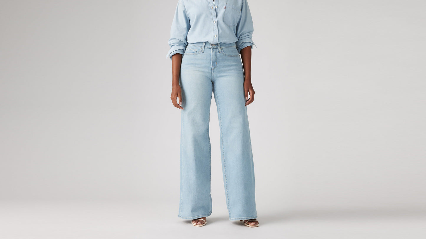 Model wearing Levi's women's jeans, washed, close-up front view