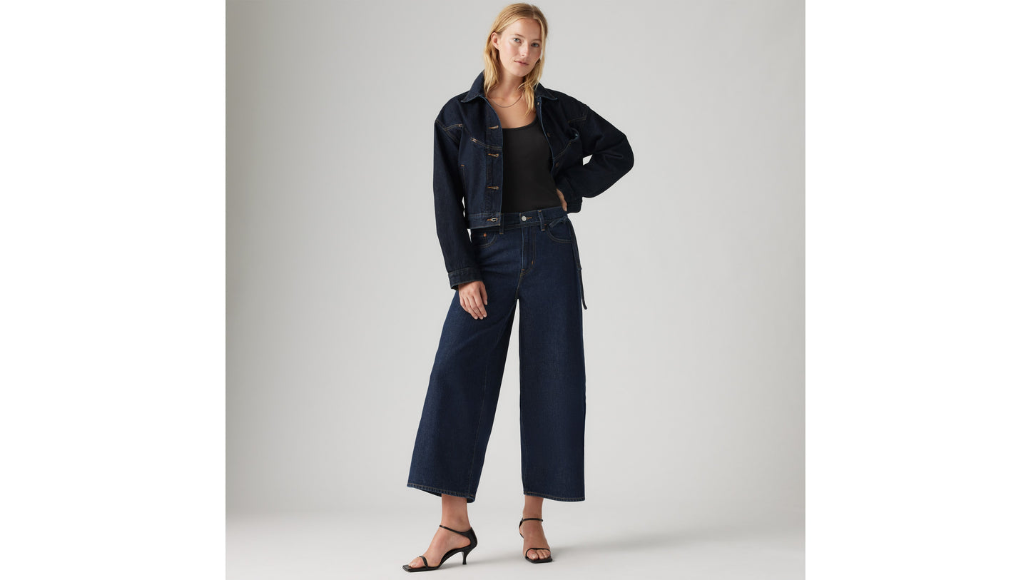 Woman in Levi's wide-leg jeans and cropped denim jacket