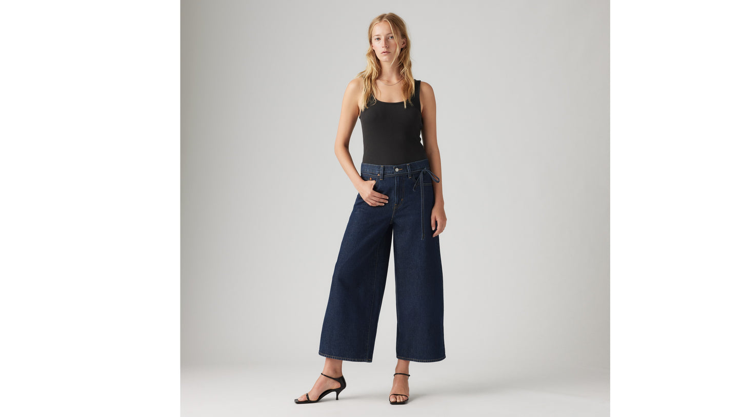 Woman in Levi's wide-leg dark denim jeans