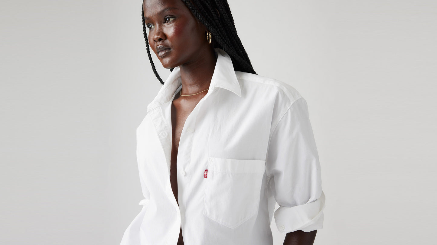 Woman in Levi's white long sleeve button shirt close-up view