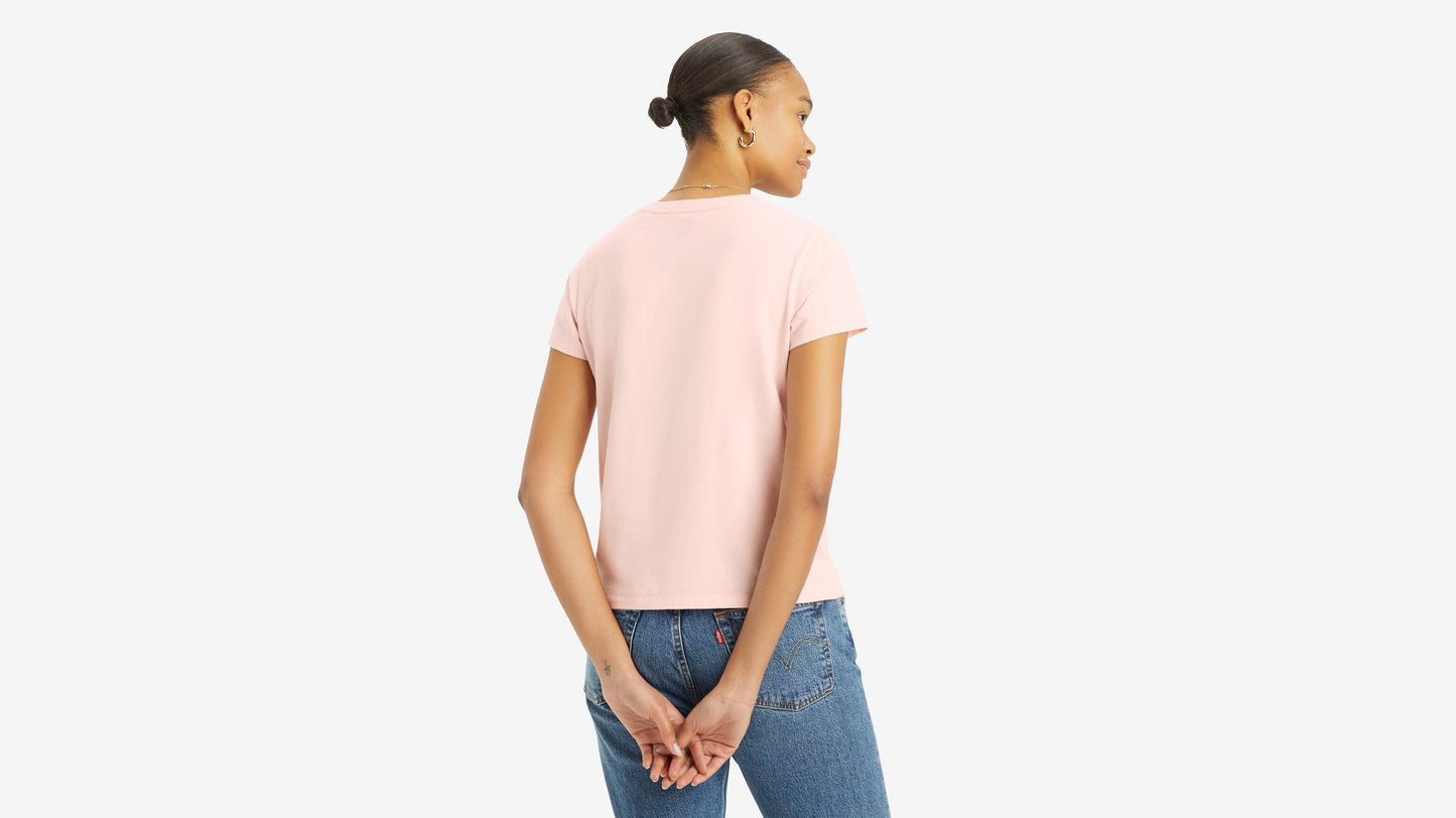 Back view of woman in pink Levi’s shirt and jeans