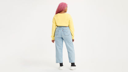 Woman in light-wash Levi's jeans back view