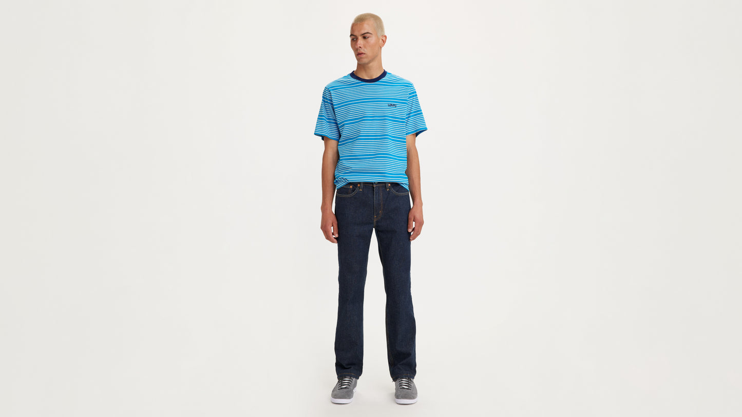 Man in stripe shirt and straight Levi's jeans