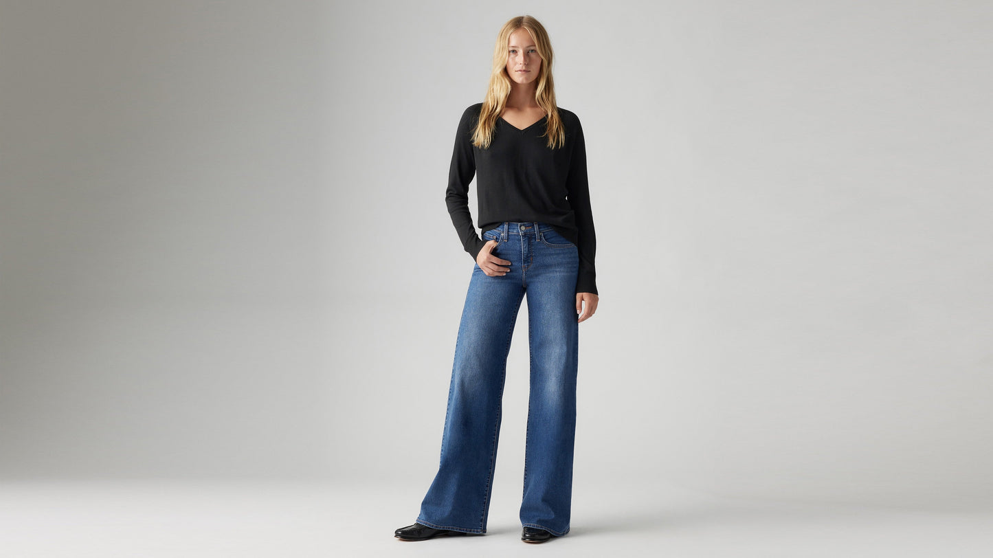 Model wearing Levi's women's jeans, front view