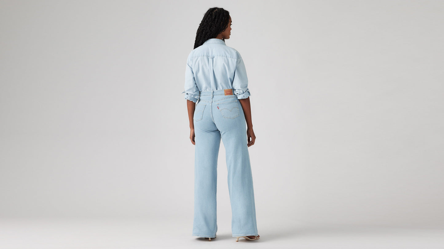 Model wearing Levi's women's jeans, washed, back view