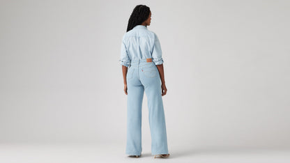 Model wearing Levi's women's jeans, washed, back view