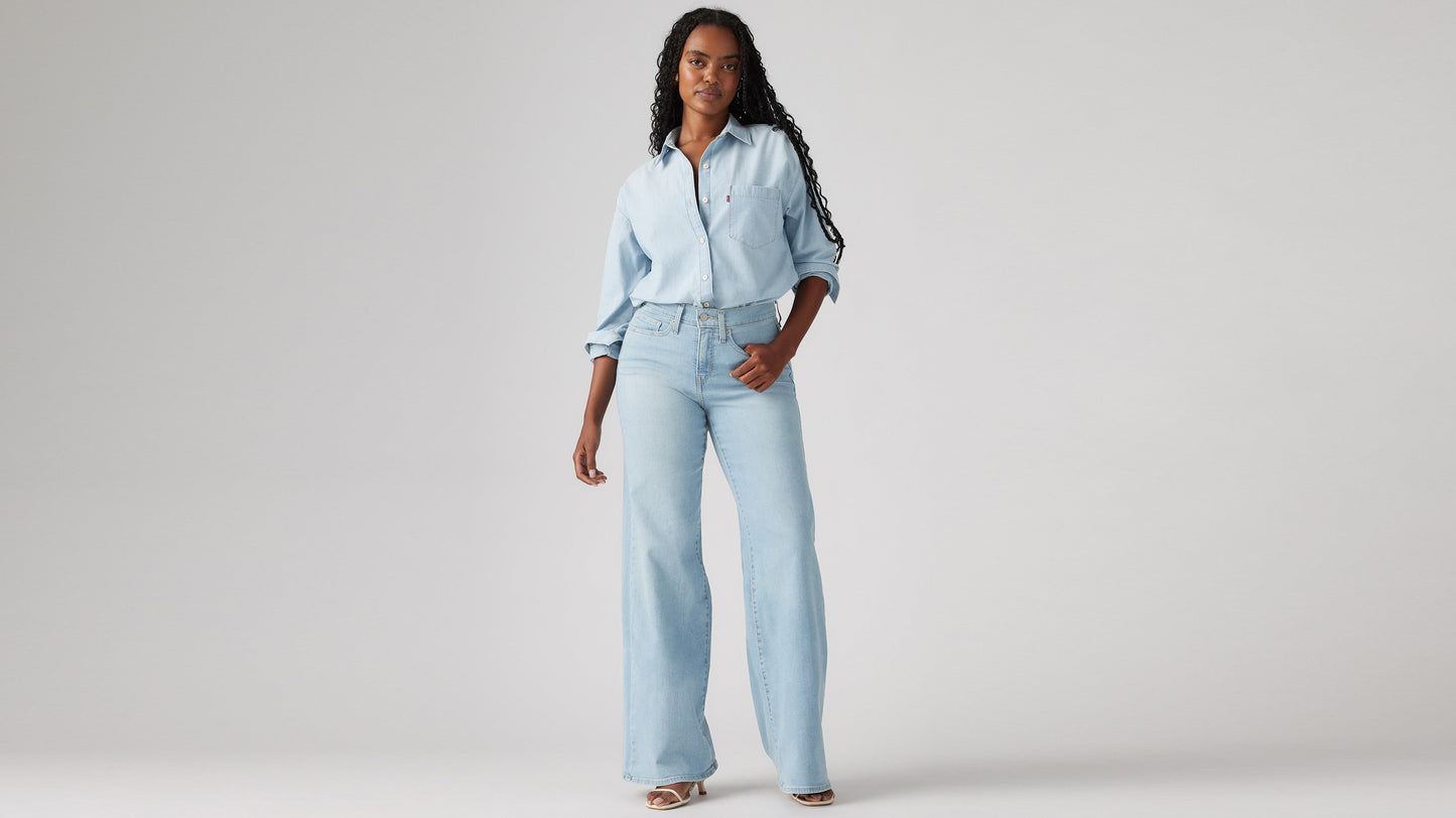 Model wearing Levi's women's jeans, washed, front view
