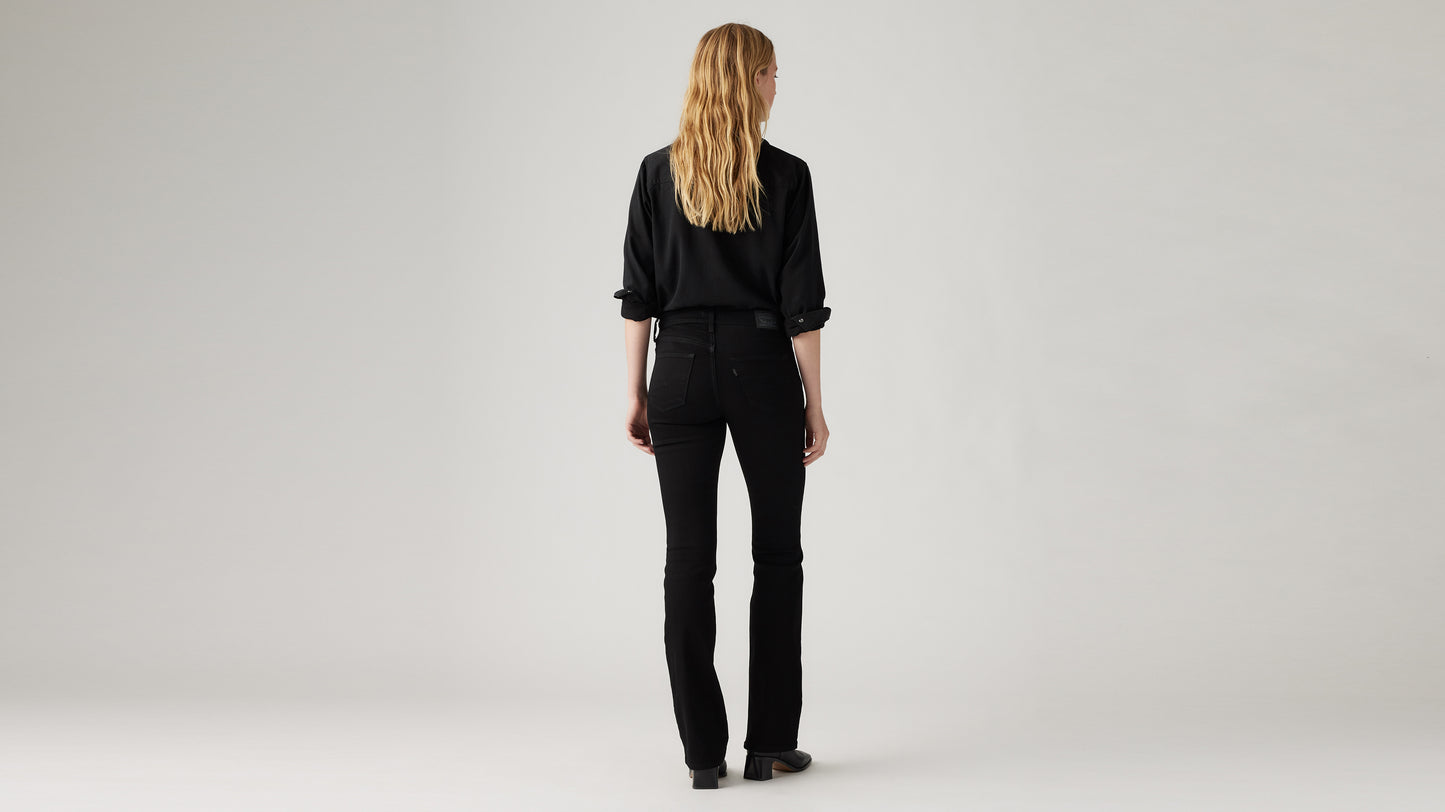 Back view of woman in black shirt and jeans
