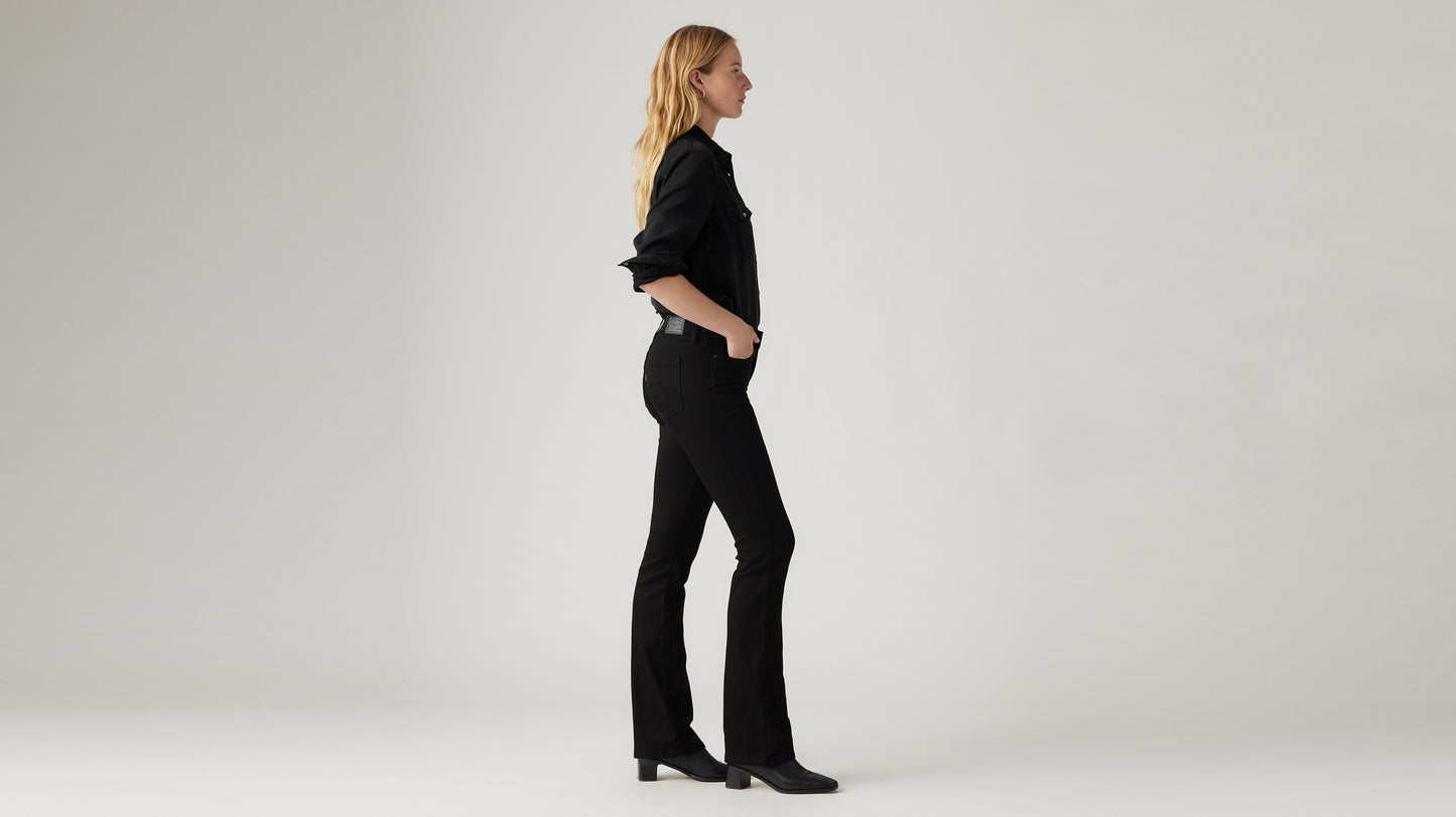 Side view of woman in black shirt and jeans