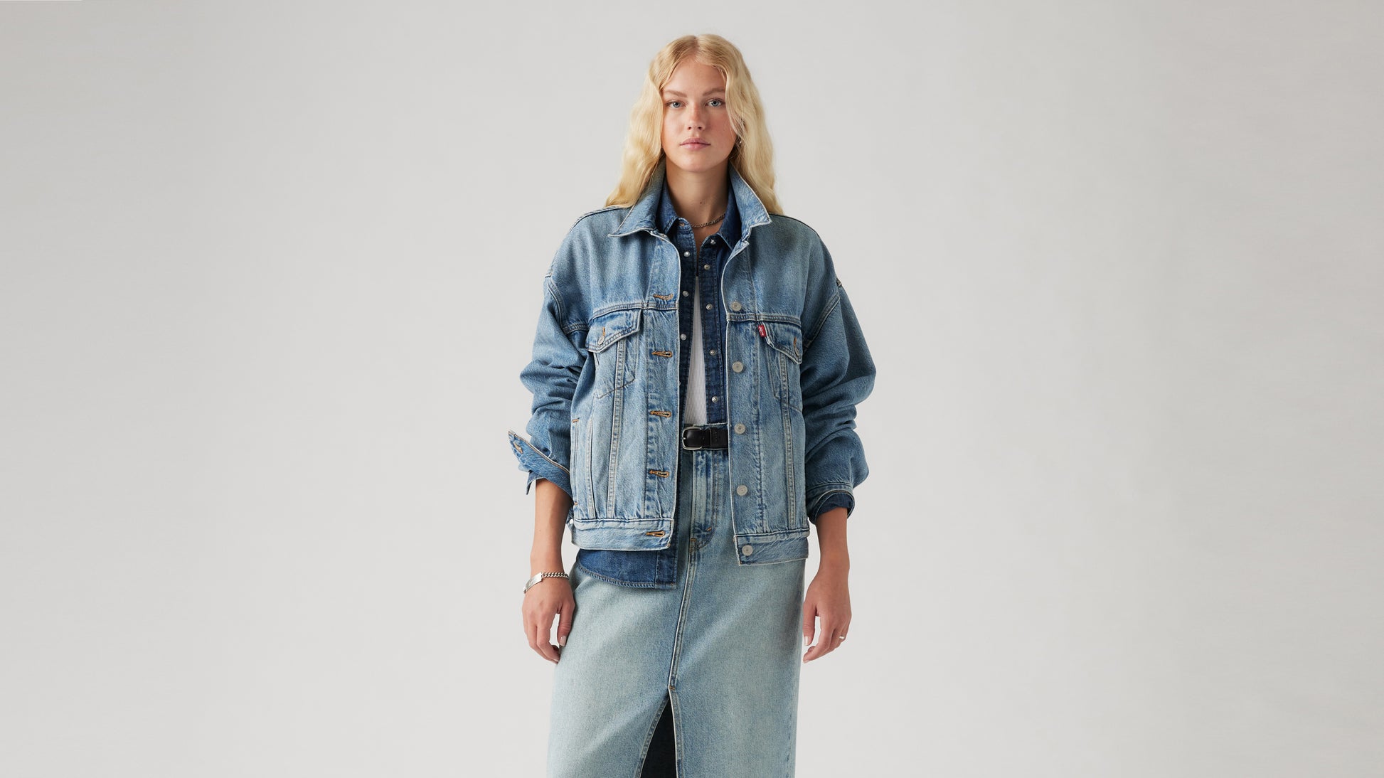 Woman wearing oversized Levi's denim jacket and skirt