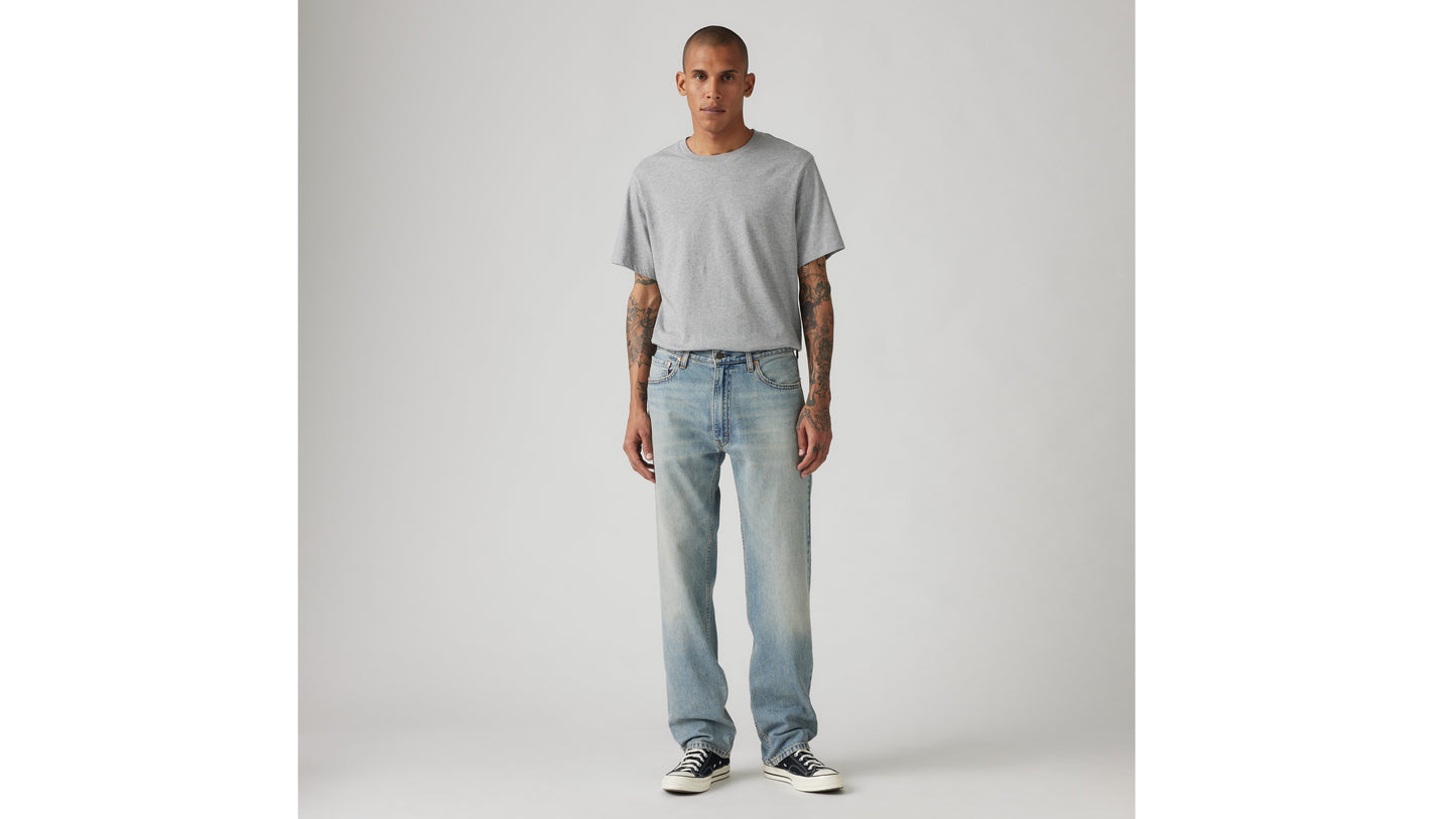 Man wearing Levi's grey tee and light-blue jeans