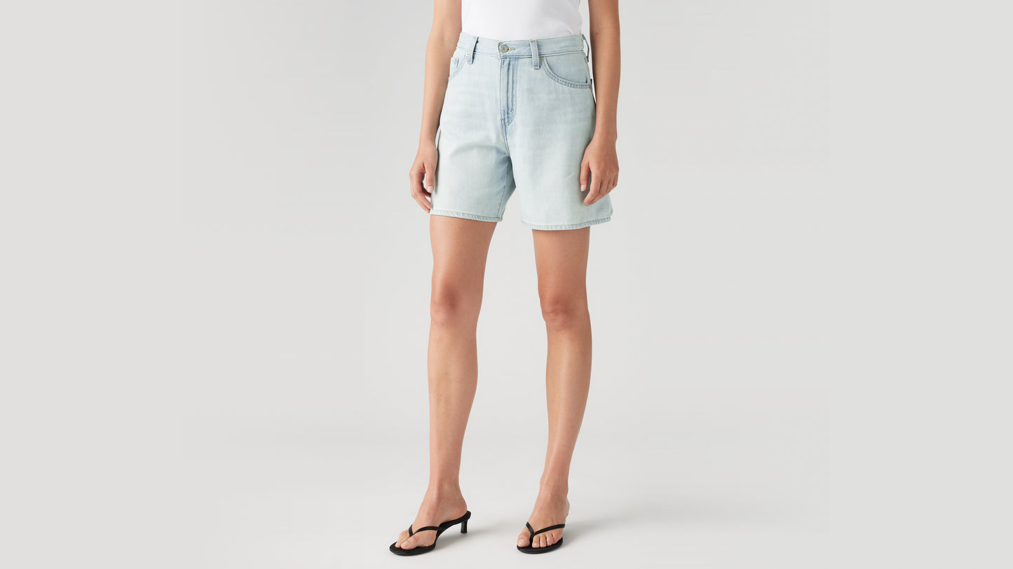Close-up side view woman wearing Levi's denim shorts