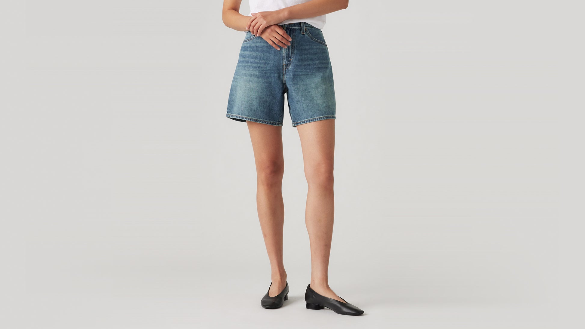 High-waisted light-blue denim shorts with subtle fade