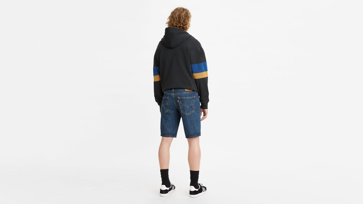 Back-facing shot of model in Levi’s color-blocked hoodie & 405 Standard Shorts