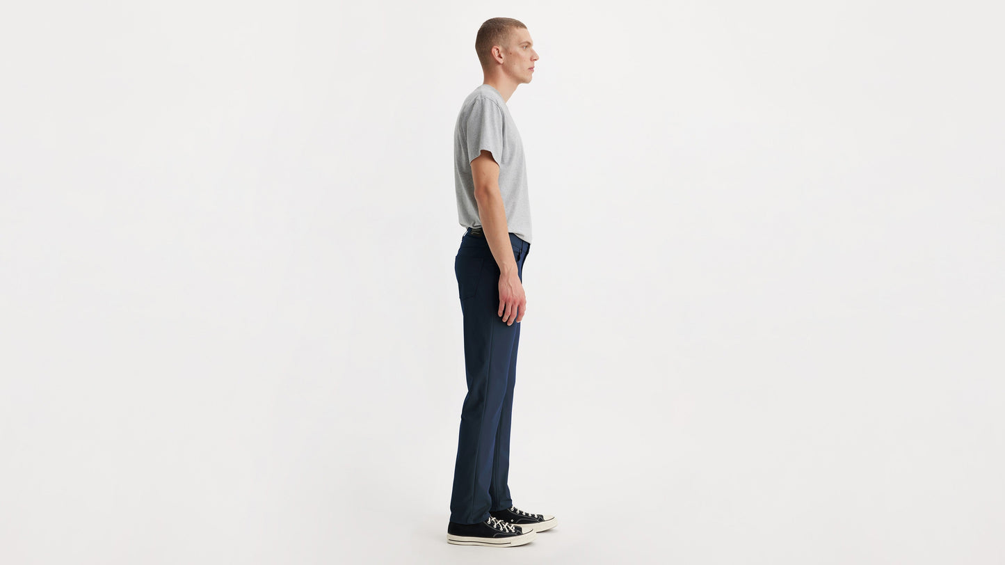 Side view of model in Levi’s slim fit tech pants and sneakers