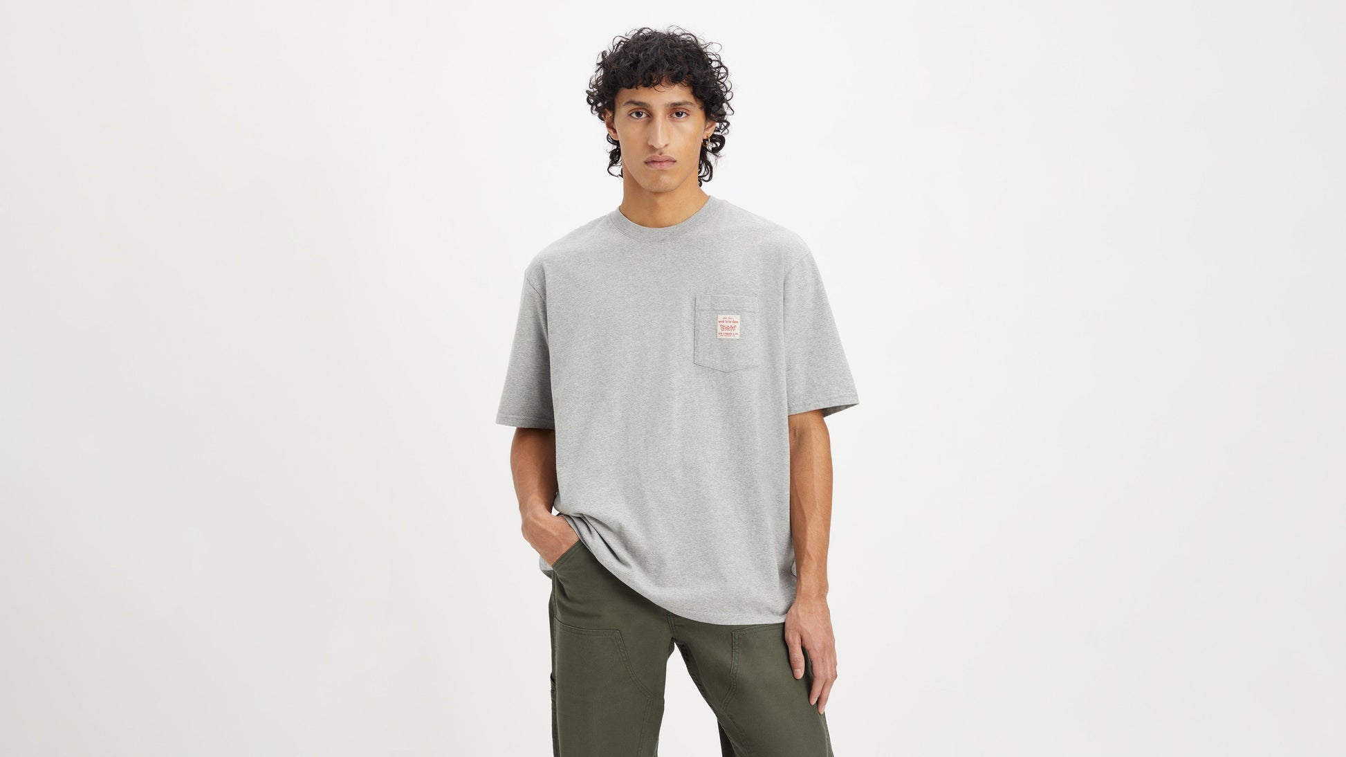 Model in Levi's mens gray short sleeve workwear shirt fron view