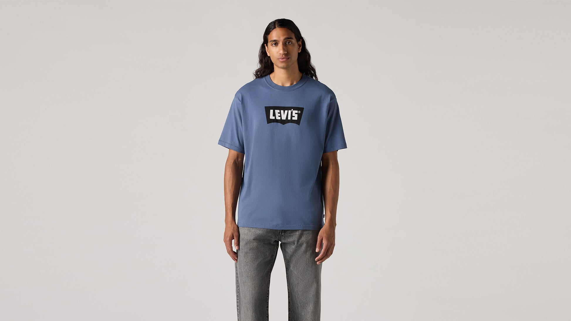 Model in Levi's mens blue round neck tee shirt