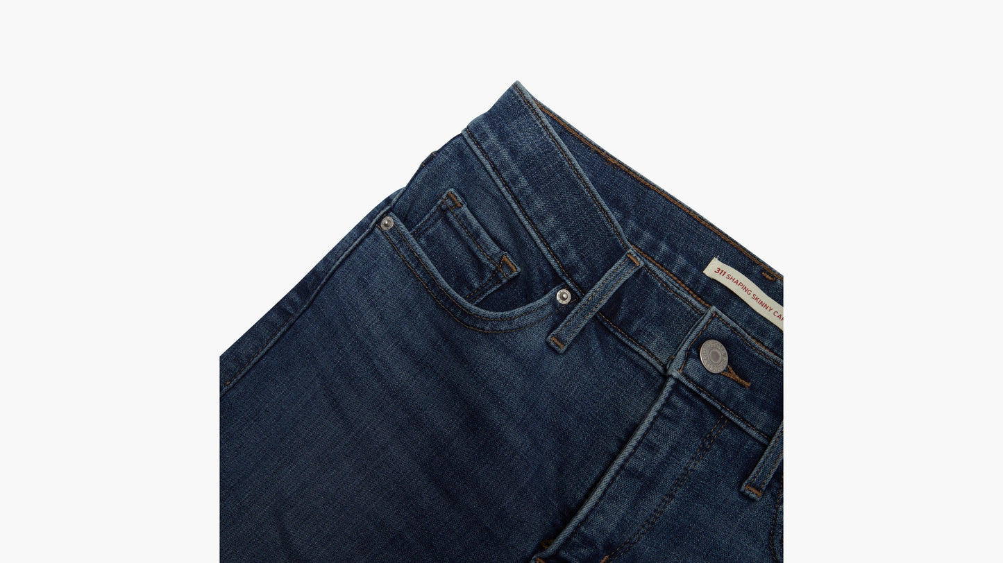 Detail of Levi’s dark blue jeans with button and coin pocket