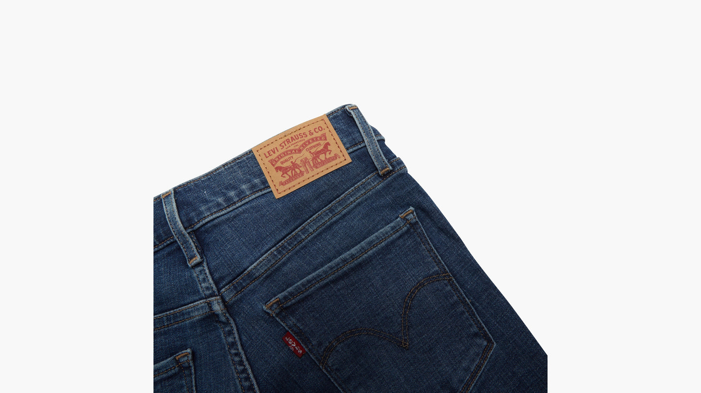 Back pocket and leather patch detail on Levi’s dark denim jeans