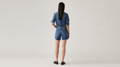 Back view of Woman in Levi's mid thigh shorts and long sleeves