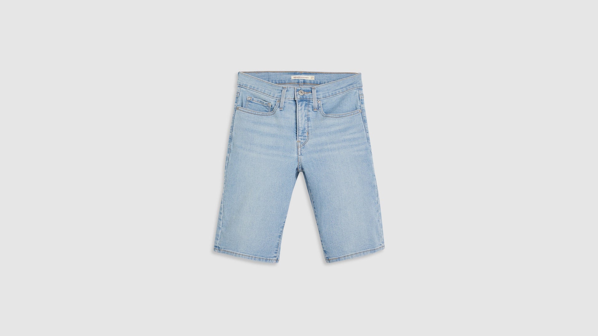 Front view of womens faded blue shaping bermuda shorts