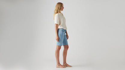 Side view of womens faded blue shaping bermuda shorts