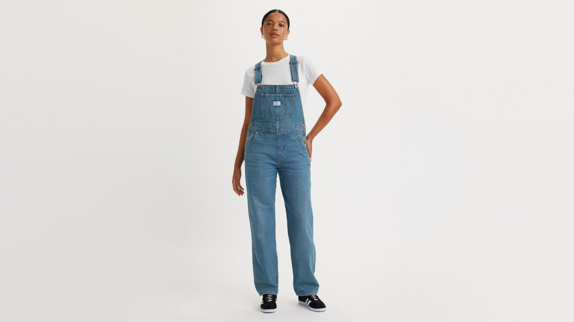 Woman in Levi's womens vintage denim overalls