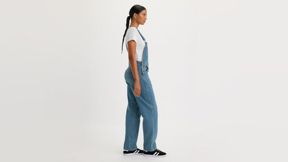 Side view of woman in Levi's womens vintage denim overalls